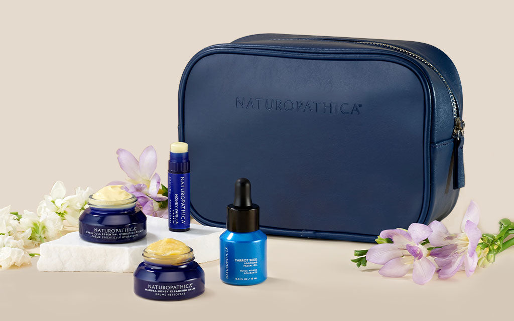 skin soothing set with ingredients featured and navy cosmetic bag